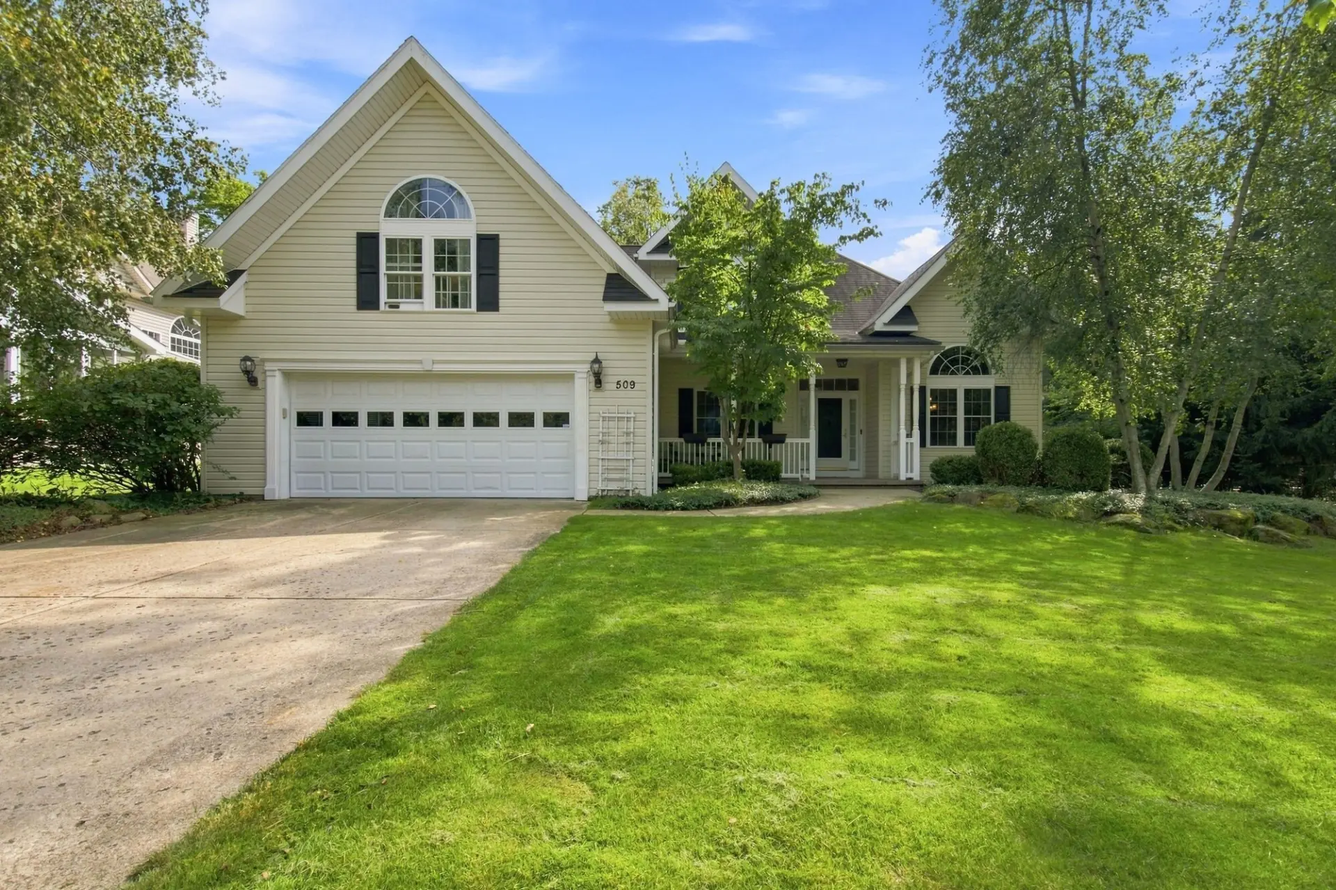 Front exterior of a two story Erie area home on a summer day