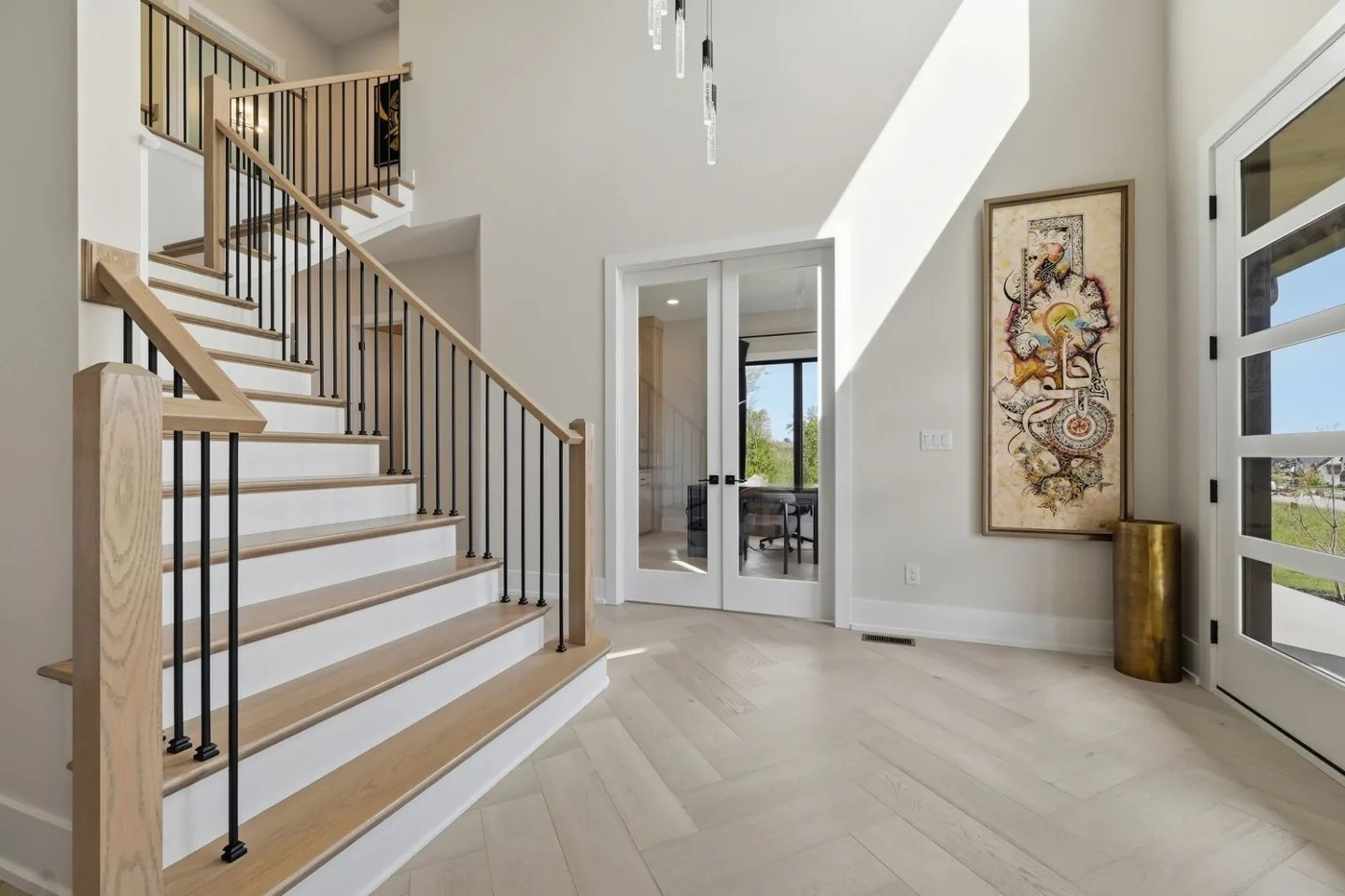 Two story foyer with open staircase in a Pittsburgh area home
