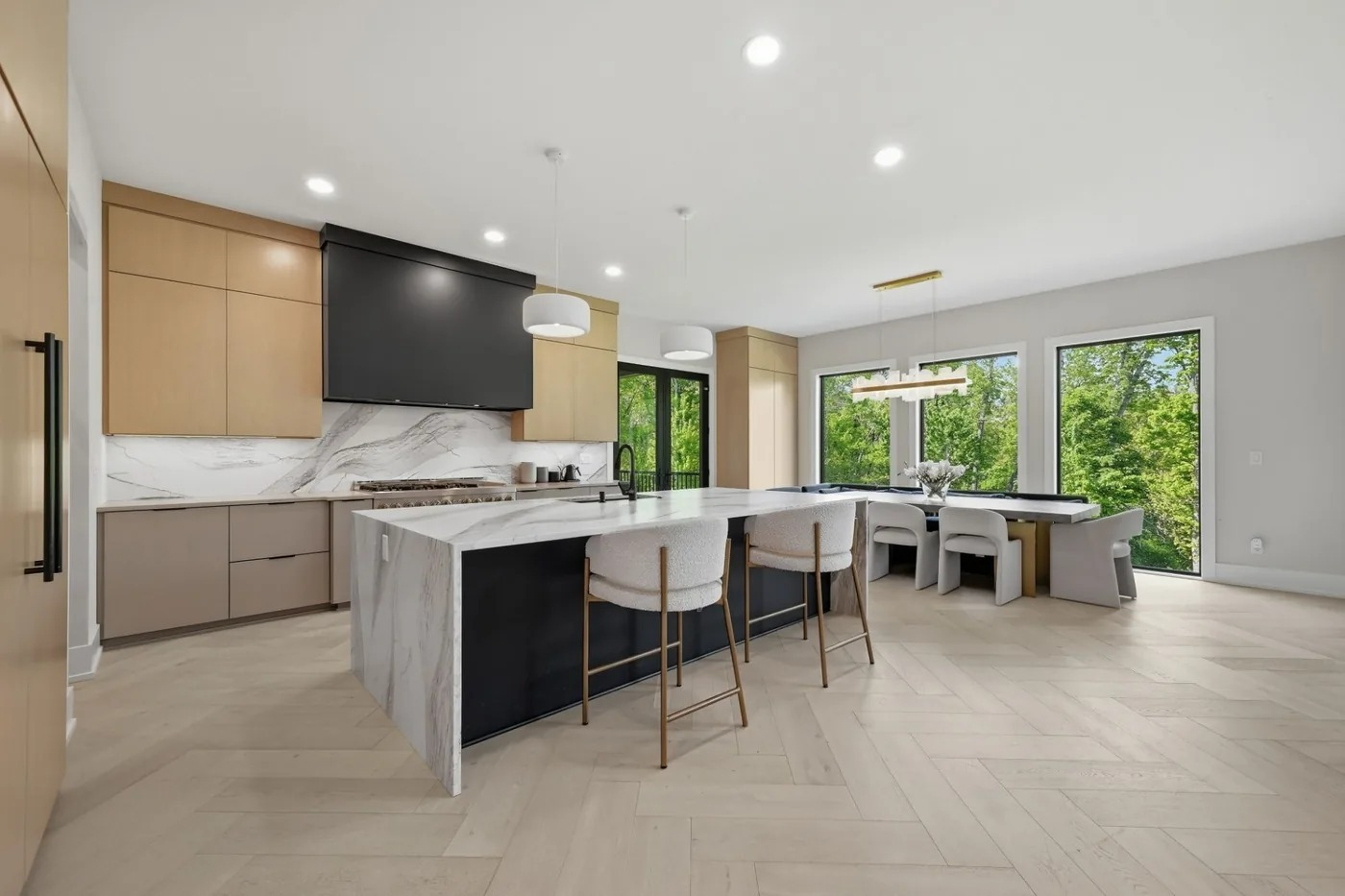 Modern kitchen with marble waterfall island in a Pittsburgh listing