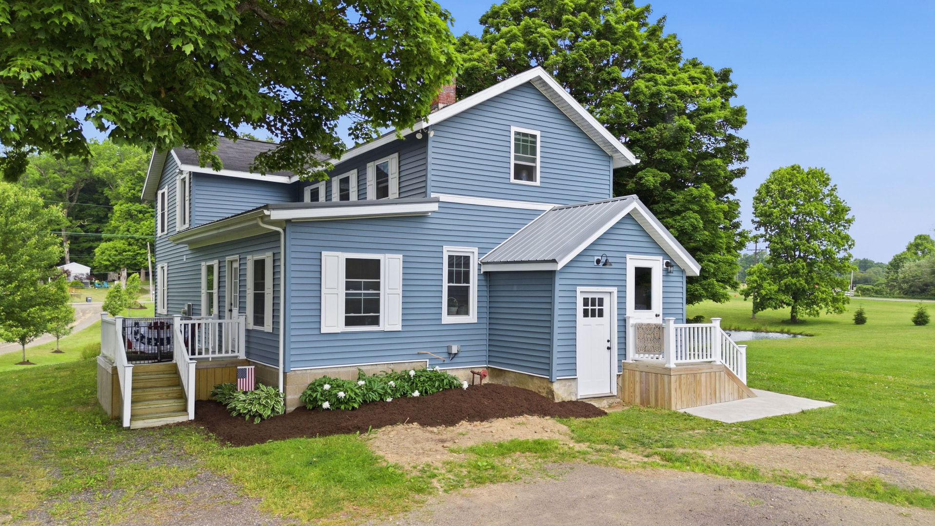 Blue farmhouse listing photographed by Exposure It in Erie County