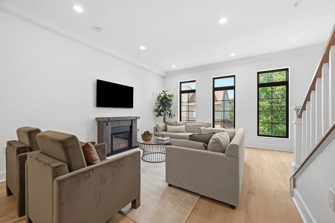 Bright staged living room with fireplace in a Pittsburgh listing