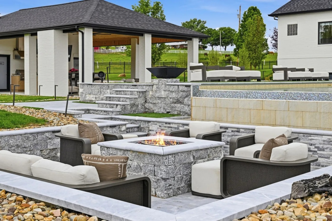 Backyard fire pit lounge and pool of a Pittsburgh area luxury home